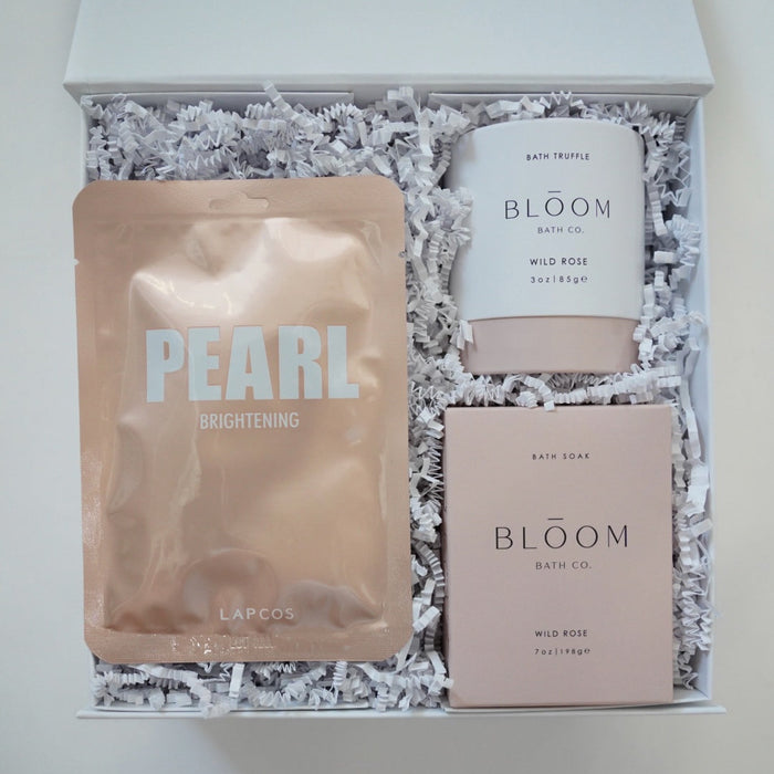 Bath product set with 'Pearl' and 'Bloom' packaging in a decorative box.