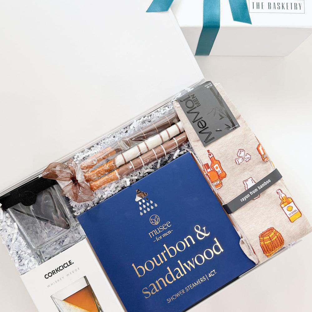 Gift set with bourbon and sandalwood theme on a white background