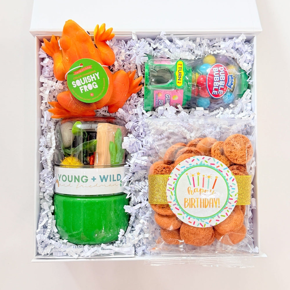Gift set with gummy animals and candy in a box on a white background