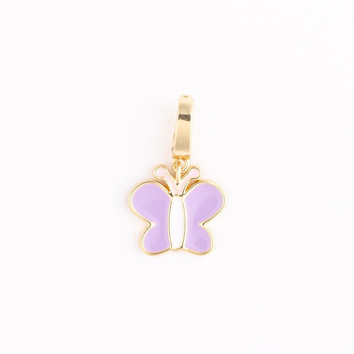 Gold enamel butterfly charm centered on a plain white background featuring lavender purple wings, a slender white body, and a polished gold-toned metal frame with a matching top bail