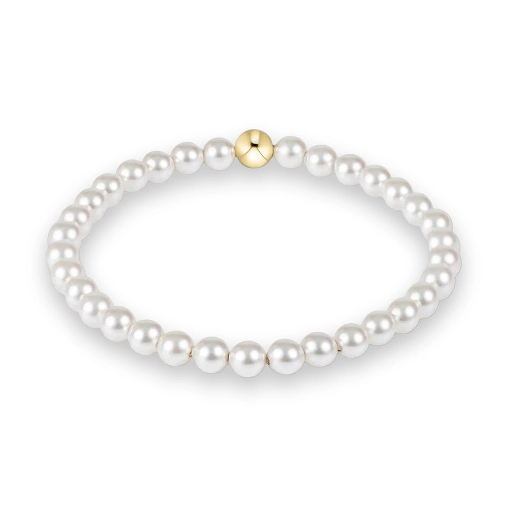 Pearl bracelet with a gold clasp on a white background
