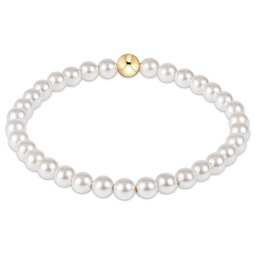 Pearl bracelet with a gold clasp on a white background