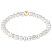 Pearl bracelet with a gold clasp on a white background