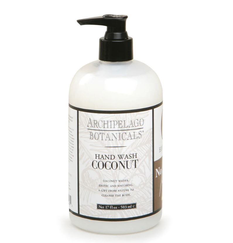 Studio product photograph by Archipelago Botanicals of a Coconut Hand Wash bottle centered on a white background featuring a black pump head and a white label with tan palm leaf designs and bold black typography