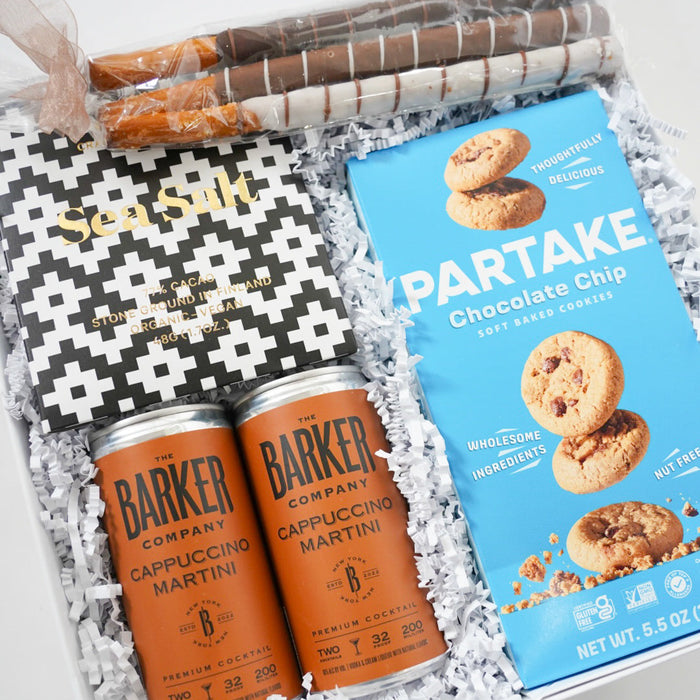 Gift set with 'Barker' coffee cans and 'Partake' cookies in a decorative box.