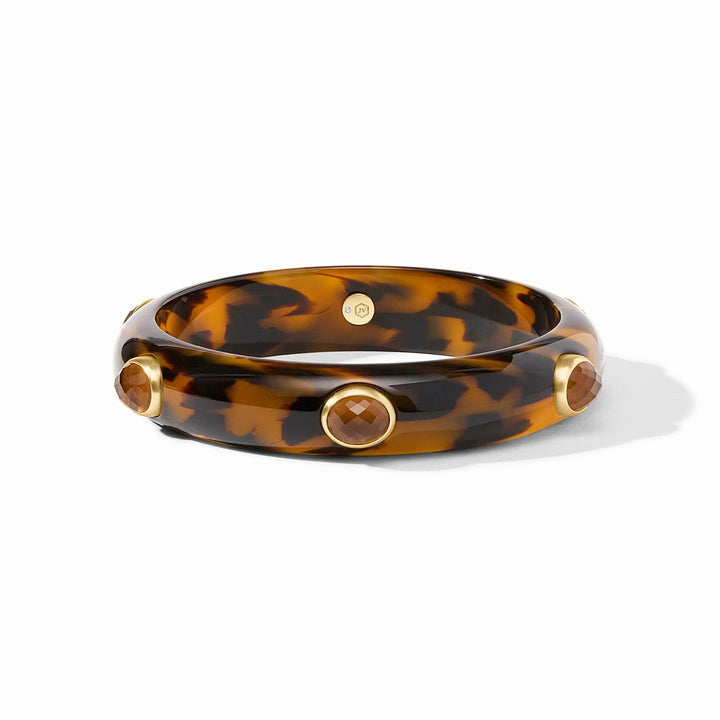 Julie Vos tortoiseshell resin bangle featuring faceted honey-colored gemstones in gold-plated settings and a signature hallmark seal against a clean white background