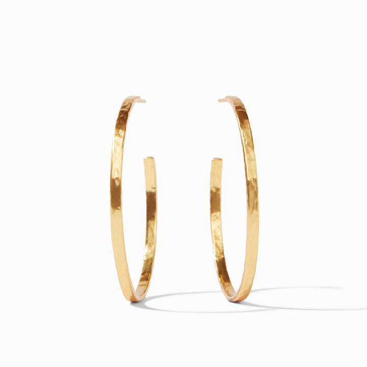 Gold plate hammered hoop earrings by Julie Vos on a white background featuring a textured metallic finish and thin minimalist silhouette