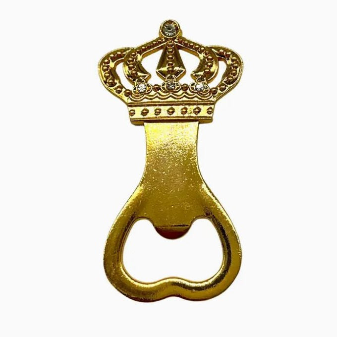Gold-tone metal bottle opener featuring an intricate filigree crown handle embellished with clear rhinestones and a polished finish against a white background