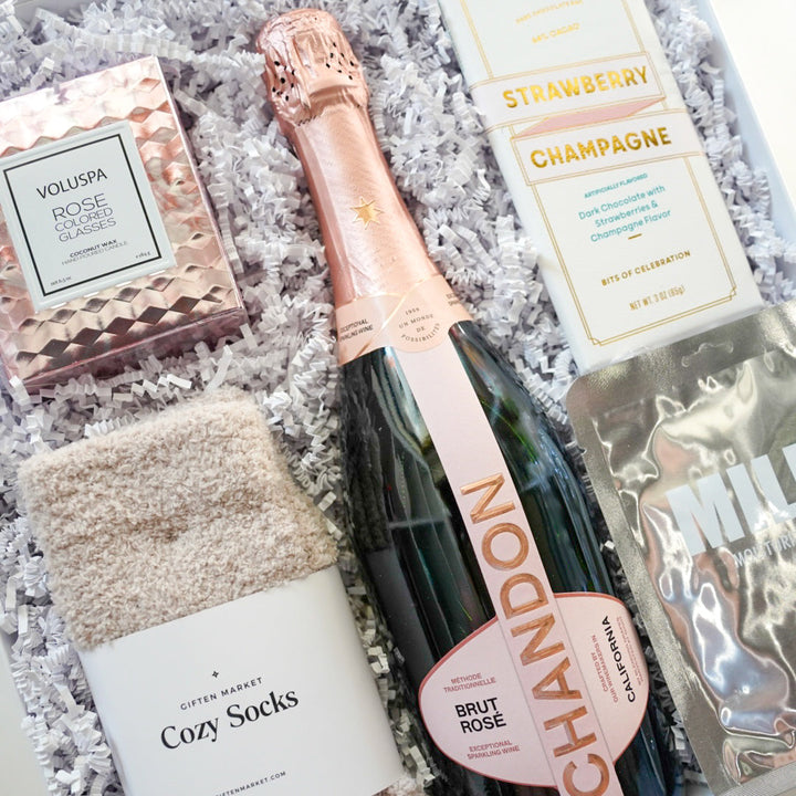 Gift set with Chandon champagne, socks, and other items in a box