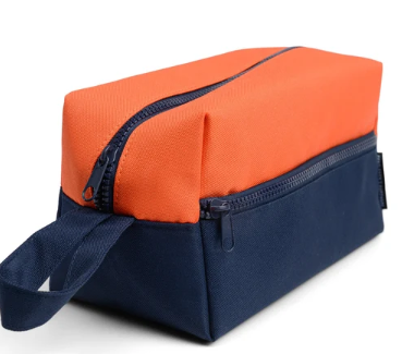 Orange and navy zippered toiletry bag with a navy carry strap