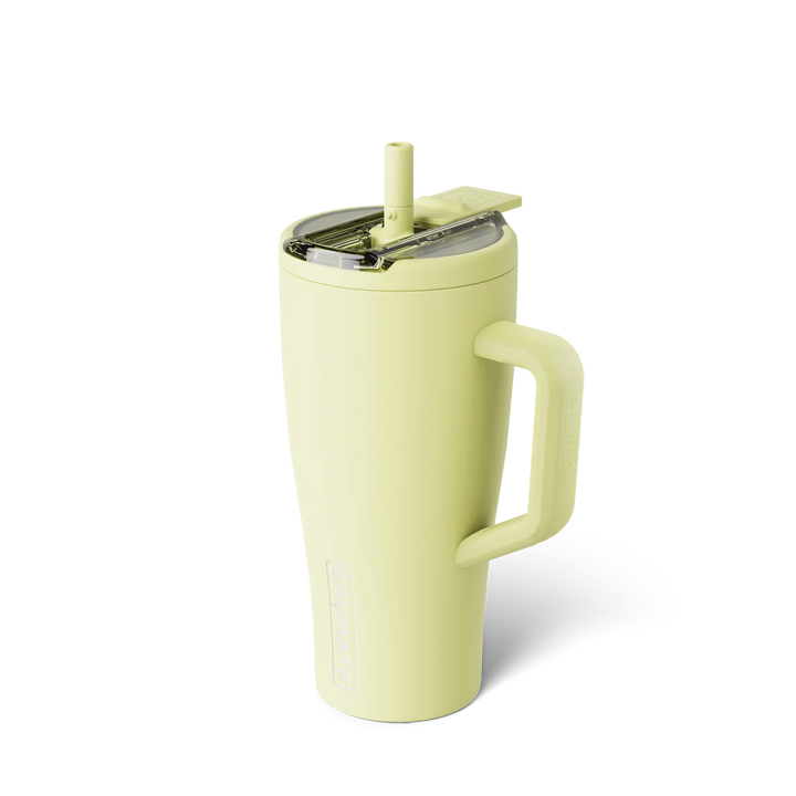 Studio product photograph by BrüMate of a citron yellow Era insulated tumbler on a white background featuring a matching silicone straw, ergonomic handle, and embossed brand logo
