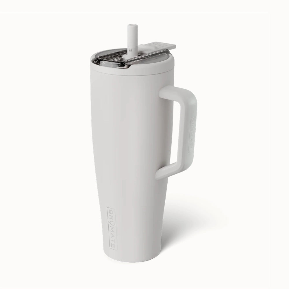 Product photograph by BrüMate of a matte white insulated Era tumbler featuring an ergonomic handle, a clear leak-proof lid with a built-in straw, and embossed branding against a plain background
