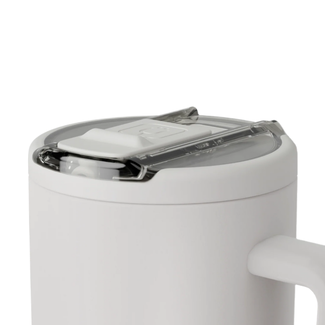 Product photograph by Miir of a white insulated camp mug featuring a clear press-fit lid with a white sliding closure and a debossed brand logo