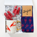 Gift set with mug, socks, and decorative items in a box