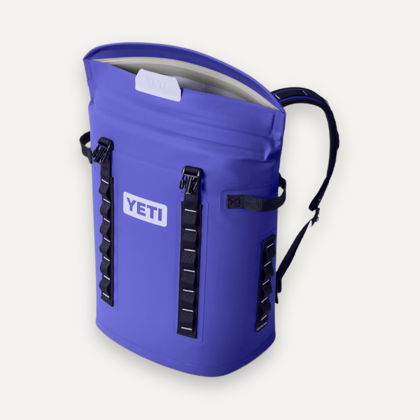 Violet YETI soft cooler backpack with the top open, angled view