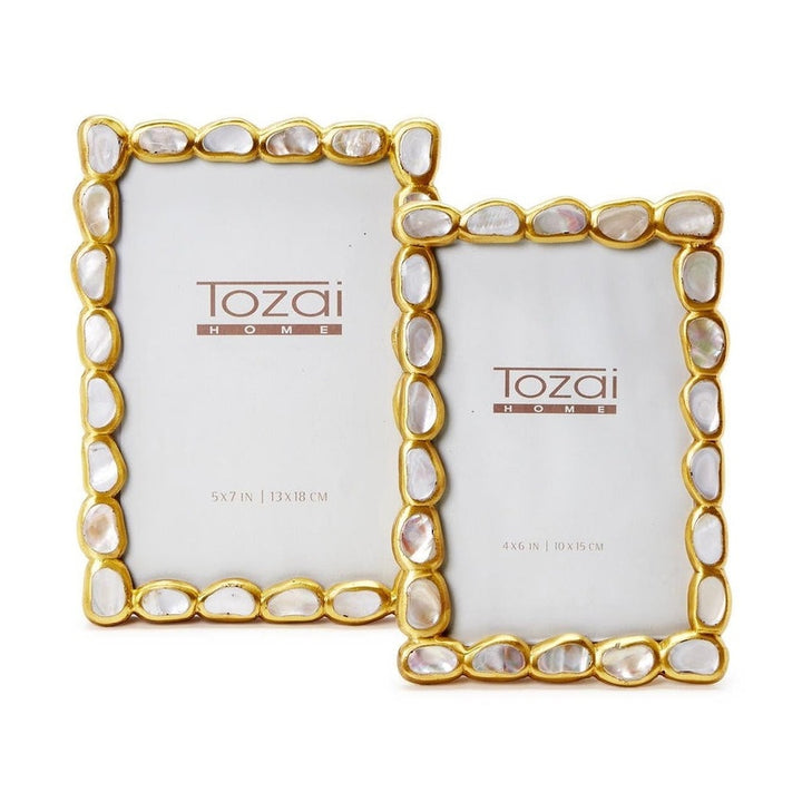 Tozai Home decorative picture frames featuring iridescent mother-of-pearl shell inlays and organic gold-finished pebble borders on a minimalist white background