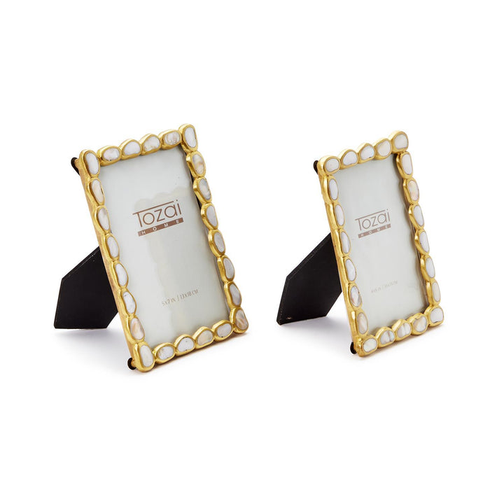 Mixed media frames by Tozai Home featuring two decorative gold-tone picture frames on a white background with scalloped edges and iridescent white mother-of-pearl shell inlays