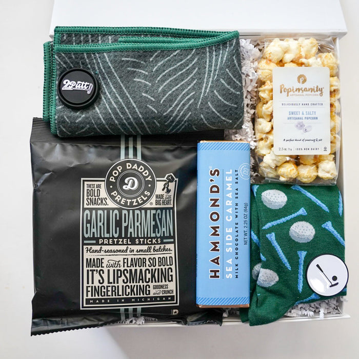 Assorted snacks and treats including pretzel sticks, popcorn, and a blue bar on a white background.