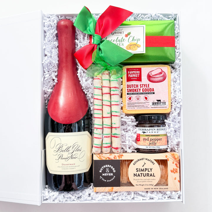 A curated gift box containing a bottle of Bell&
