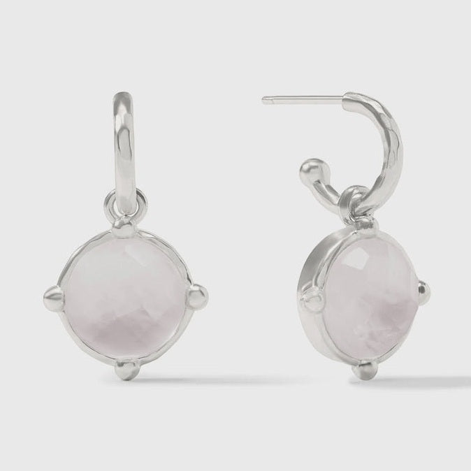 Sterling silver earrings featuring translucent pale pink faceted rose quartz gemstones in a four-prong ball setting suspended from hammered texture hoops on a neutral grey background