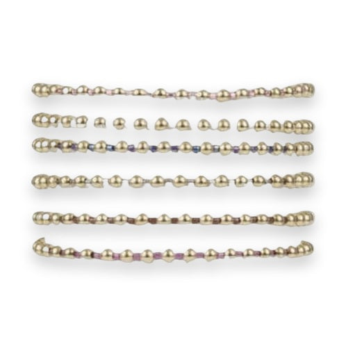 Product photograph of six stackable gold-tone beaded bracelets displayed on a white cylindrical stand featuring colorful accent beads in pink metallic, blue metallic, and fuchsia alongside text labels identifying each style color option