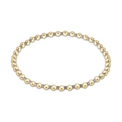 Van Cleef &amp; Arpels 18K yellow gold Perlée bracelet featuring a delicate circle of polished spherical beads with reflective surfaces and a warm golden hue centered on a white background