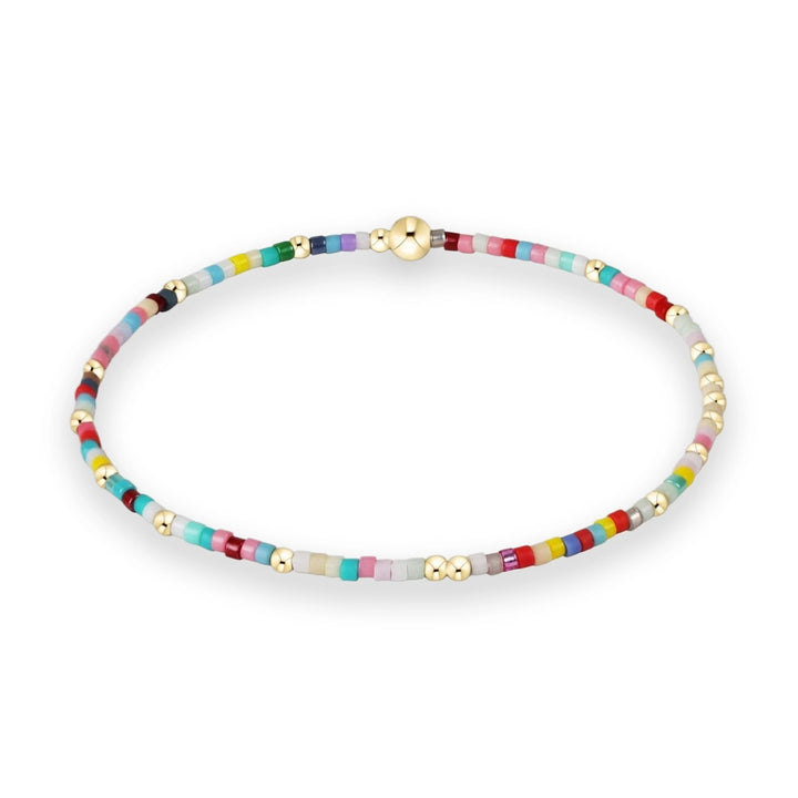 Handcrafted beaded jewelry featuring a vibrant multicolored seed bead bracelet accented with polished gold-tone spherical spacers and a central gold ball clasp on a white background