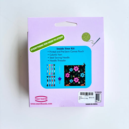 Mighty Hands Yarn Kit package showing the back of the box with product contents listed and a small image of the floral pouch inside.