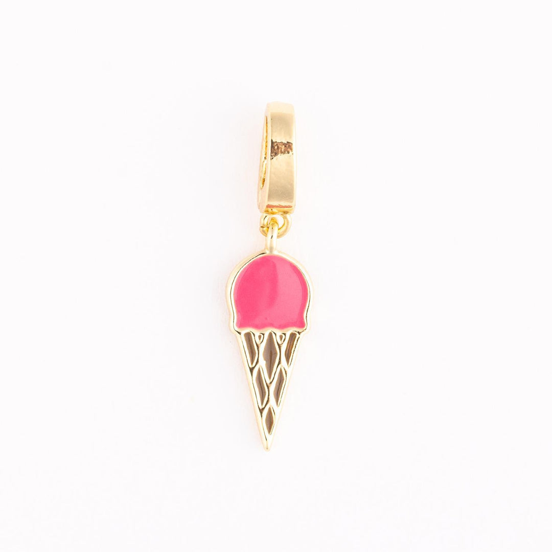 Gold-toned enamel jewelry charm of a miniature ice cream cone on a white background featuring a vibrant pink scoop and a detailed gold-etched waffle pattern dangling from a polished bail