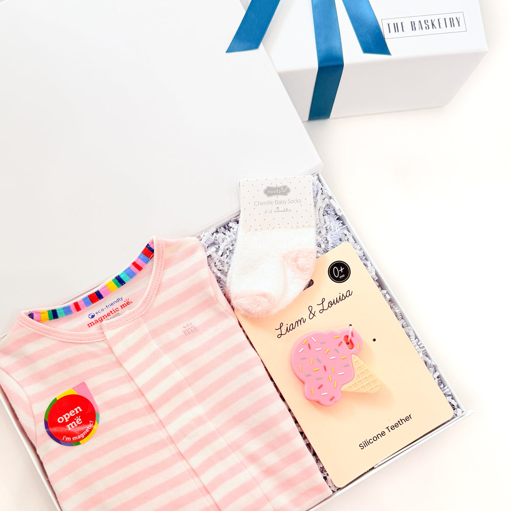 Pink striped shirt with accessories on a white background
