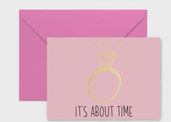 Digital graphic greeting card featuring a light pink card with a hand-drawn gold foil diamond ring and black text IT'S ABOUT TIME positioned in front of a contrasting bright pink envelope
