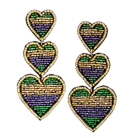 Hand-beaded jewelry features a pair of triple-tiered heart drop earrings for Mardi Gras with horizontal stripes of vibrant green, shimmering gold, and royal purple seed beads finished with a metallic gold bead border
