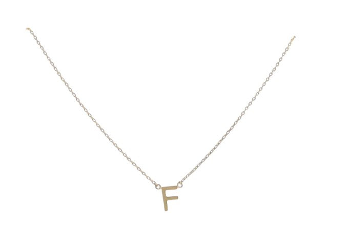 Gold jewelry necklace featuring a polished serif capital letter F pendant attached to a delicate cable chain on a clean white background with small loop connectors and a reflective metallic finish
