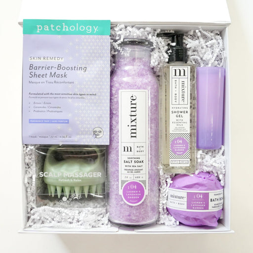 Gift set with skincare products including a box labeled 'patchology' on a white background.