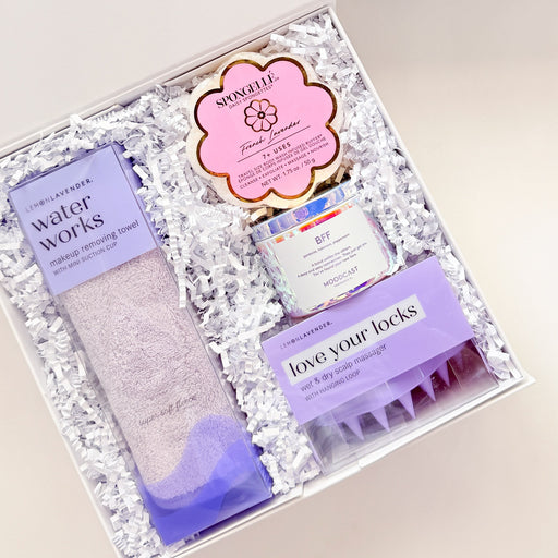 Gift set with skincare products and a blue ribbon on a white background