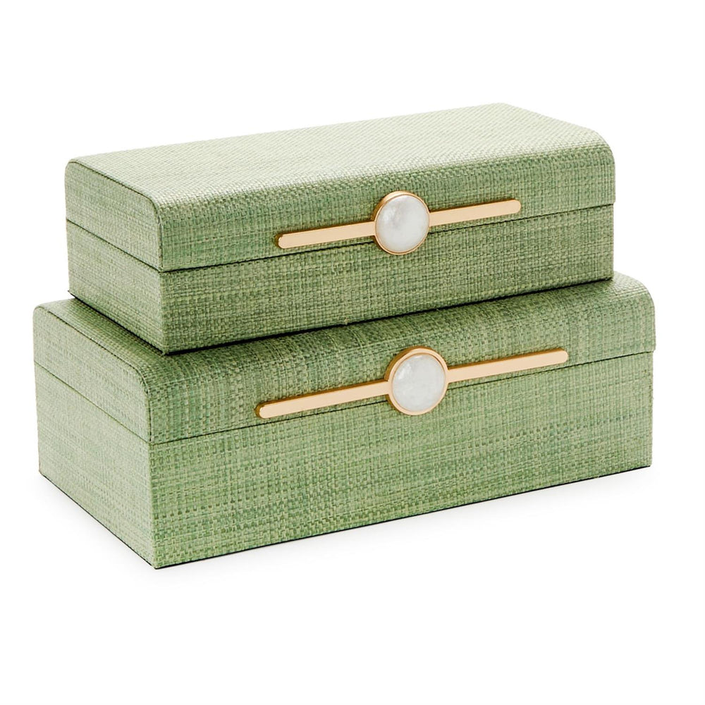Woven grasscloth and gold-toned metal decorative storage boxes set of two stacked against a white background featuring a sage green textured finish and horizontal bar latches with circular white stone accents