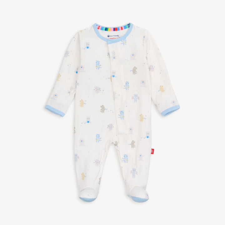 Magnetic Me cotton baby sleepsuit on a white background featuring light blue trim, a rainbow-striped inner neckline, and a whimsical print of various animals playing musical instruments