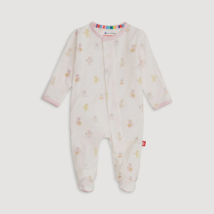 Product photograph of a Magnetic Me footed sleeper on a solid gray background featuring a whimsical animal band print, soft pink piping, and a colorful rainbow-striped interior neckline