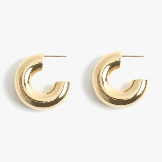 Gold hoop earrings on a white background