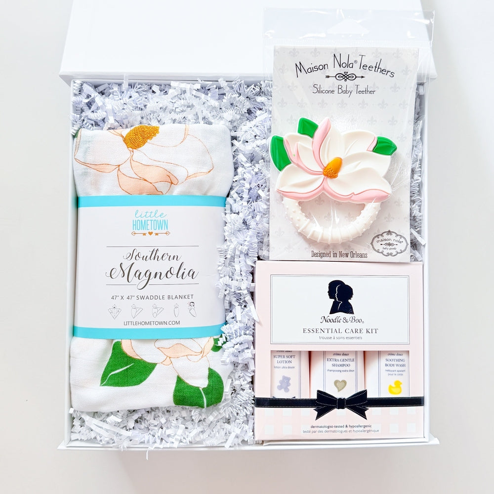 Set of baby items and packaging with decorative elements on a white background