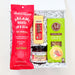 A curated gift box containing food items: a red bag of Salami & Suetie Salami Aged Low & Slow Jerky Sribada, a yellow bottle of Hunters Sweet & Sour Sauce, a jar of Herb & Pepper Jelly, and a green box of 34 Degrees Rosemary Crisps, arranged in white crinkle paper inside a white box.