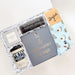 Gift set with YETI cup, Palo Santo & Sage box, and other items on a white background