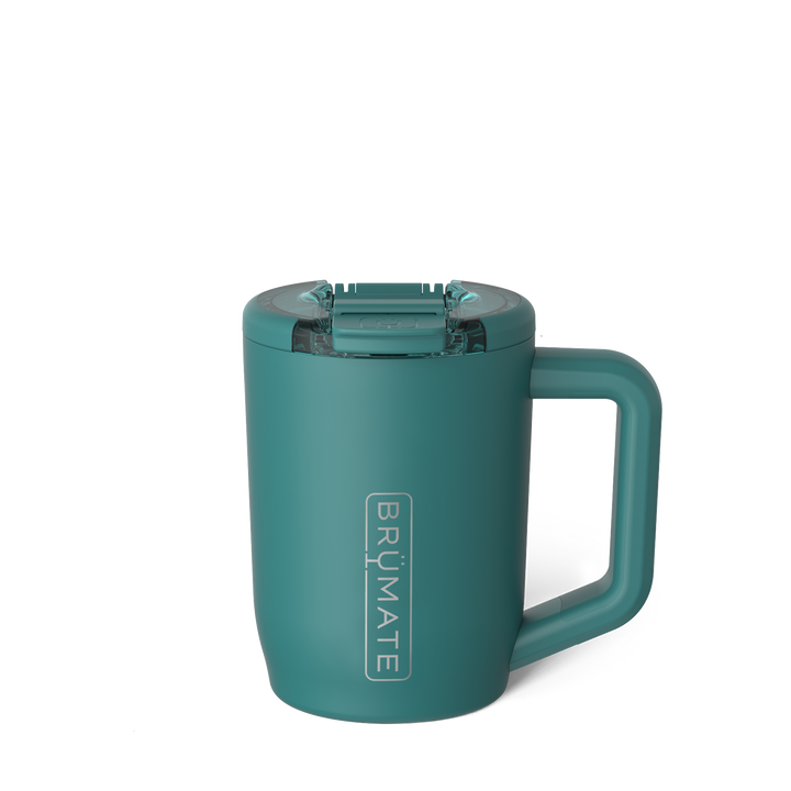 Digital product photograph by BrüMate of a matte teal insulated travel mug on a white background highlighting its vertical silver logo, translucent leak-proof lid, and integrated square handle