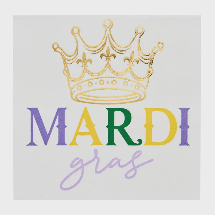 White cocktail napkin with gold foil crown above "Mardi Gras" in purple, gold and green