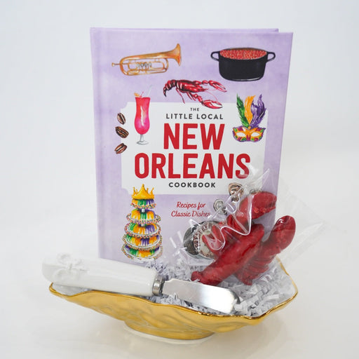 Cookbook titled 'New Orleans' on a decorative stand with a white background