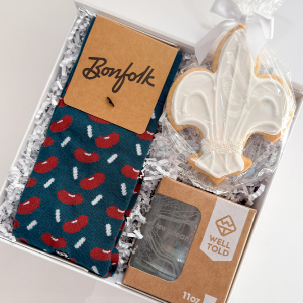 Gift box with socks, cookie, and card with &