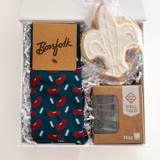 Gift set with socks, cookie, and soap in a box labeled 'Bonfolk' and 'Well Told'.