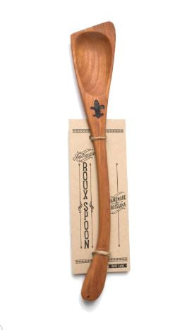 Angled wooden spoon with a fleur-de-lis burned into the handle, tied to a Roux Spoon card
