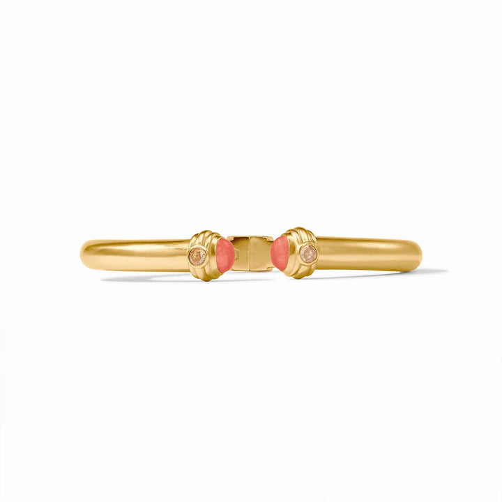 24k gold-plated brass bangle by Julie Vos featuring a hinged golden band centered on a white background with fluted end caps, vibrant pink cabochon stones, and shimmering clear crystals