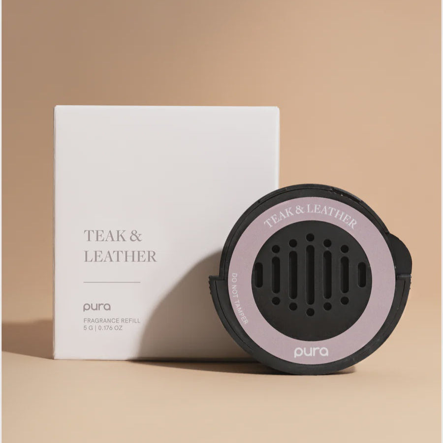Pura Teak &amp; Leather car fragrance refill disc beside its white box